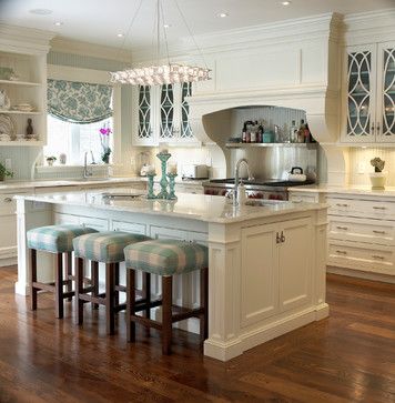   No matter how busy your mornings are, breakfast in this kitchen (by Cheryl Scrymgeour Designs),with its marble countertops, serene white cabinetry and soft blue accents, will definitely deliver some serenity.